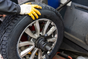 a person holding a tire
